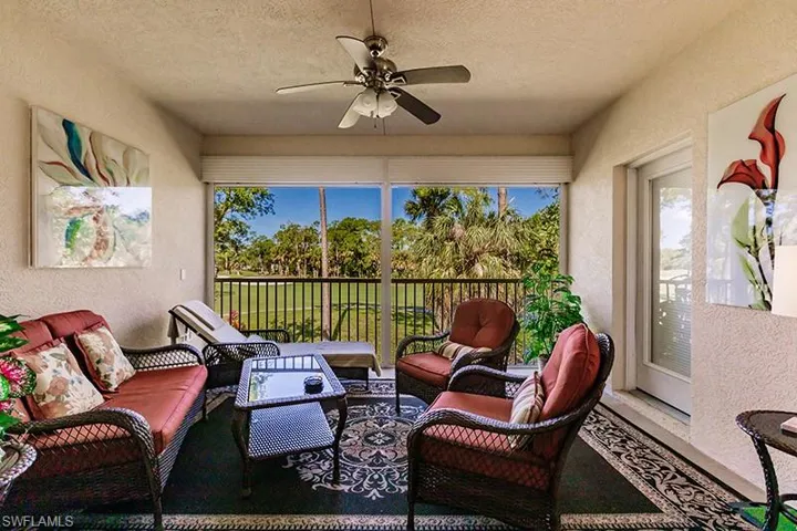View of patio with outdoor lounge area and ceiling fan