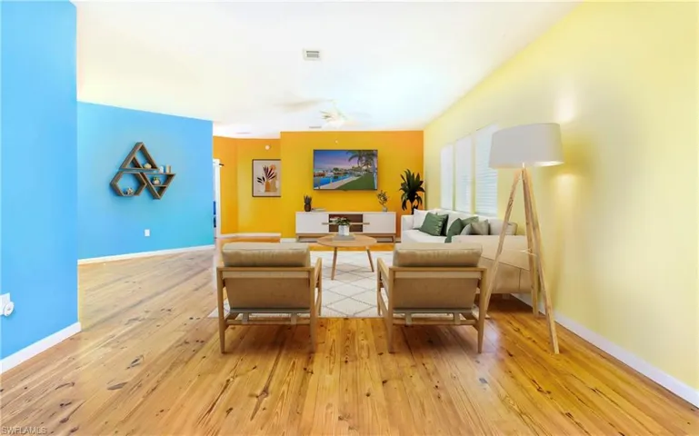 Living room with light wood-style floors and ceiling fan