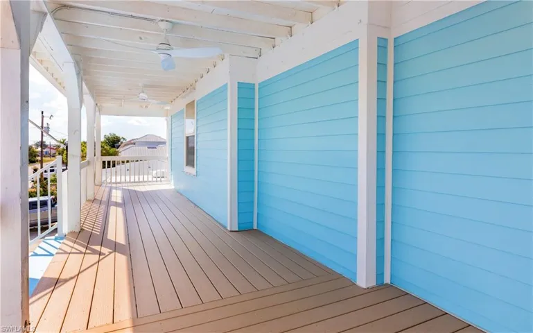 Wooden terrace with a ceiling fan