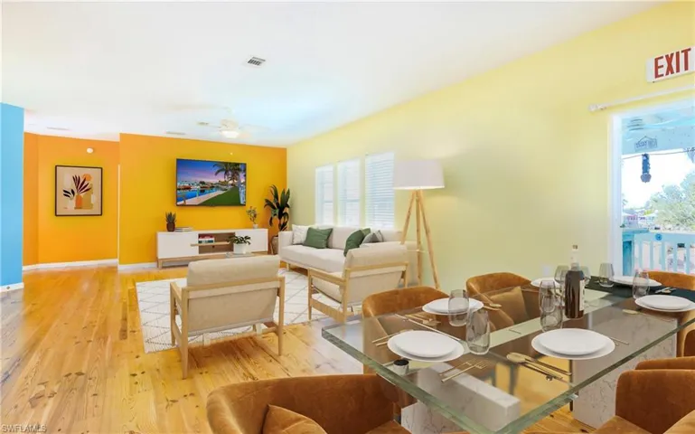 Dining space featuring light wood-type flooring and a ceiling fan