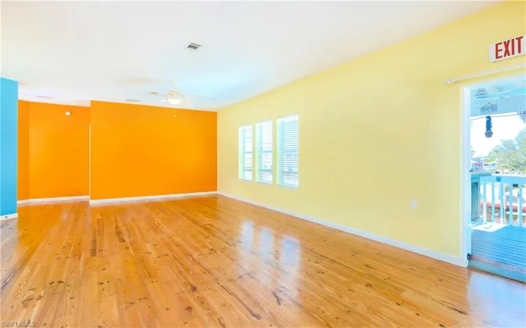 Spare room featuring light wood finished floors and ceiling fan