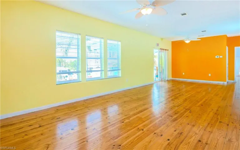 Spare room featuring hardwood / wood-style floors and a ceiling fan