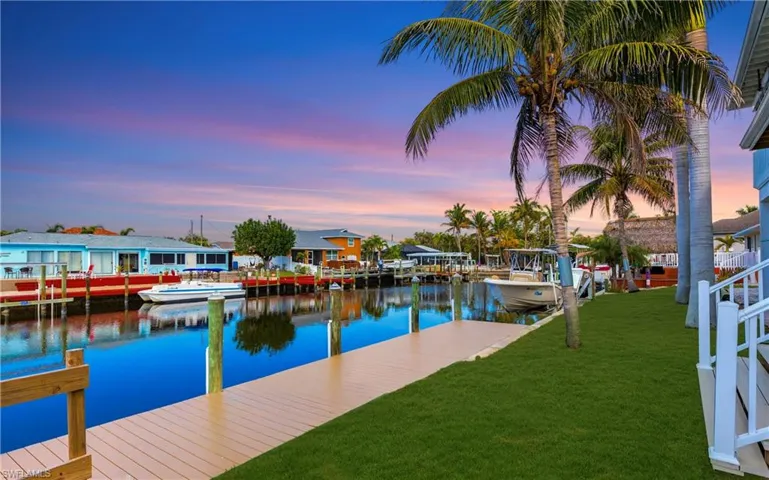 Dock with a yard and a water view