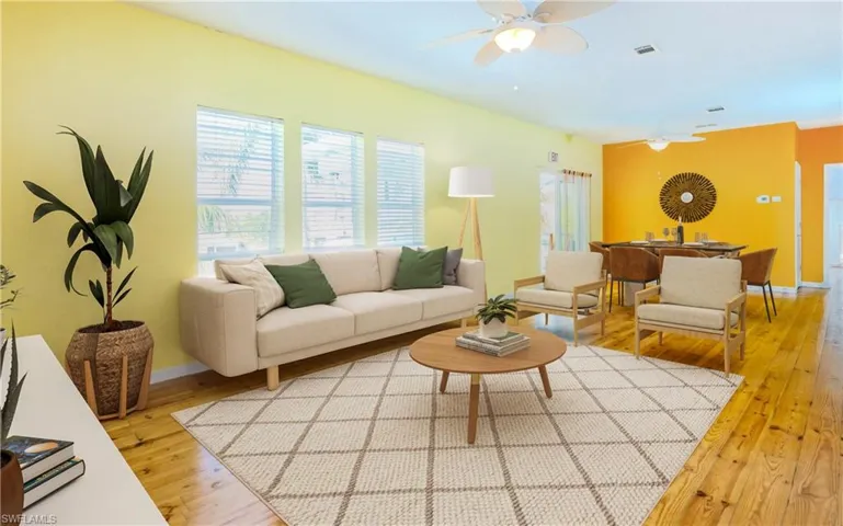 Living room featuring light wood finished floors and ceiling fan