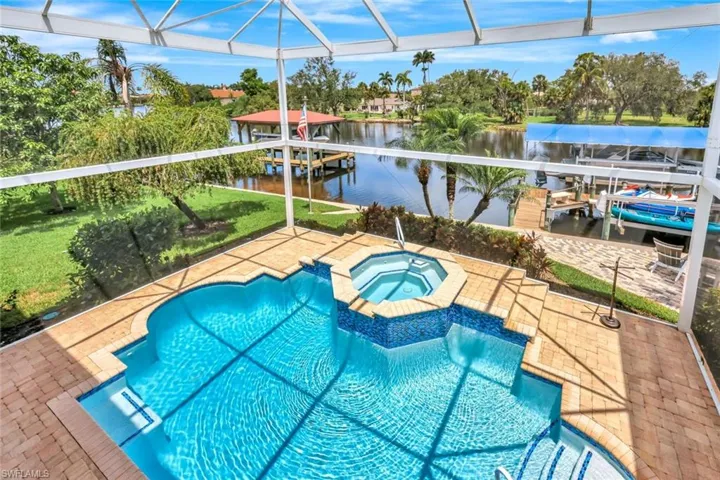 Relax in the fully screened riverside lanai area.