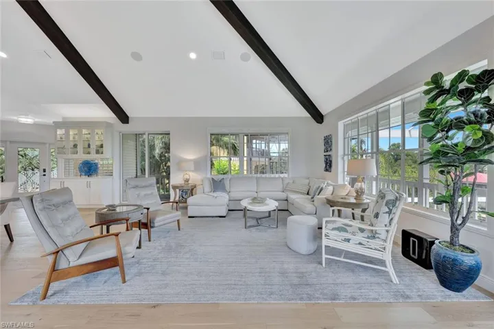 Notice the wood flooring, the dry bar and all of the WINDOWS!