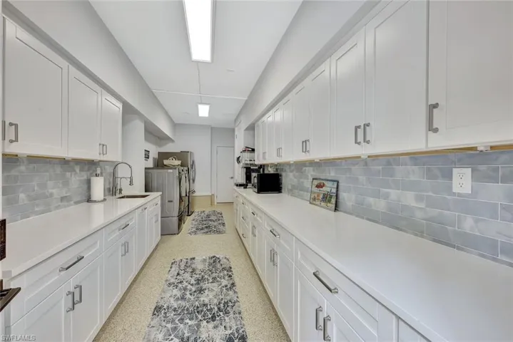 Lower level butler’s pantry or beverage area—you will appreciate all of the storage area while entertaining.