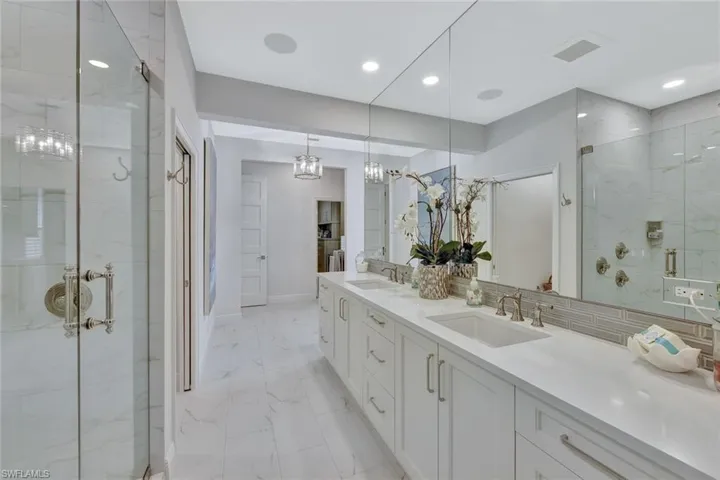 Spa-like ensuite with separate sink areas, a gorgeous shower, plenty of cabinet space and a TON of light!