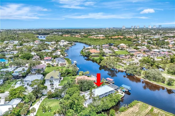 This PRIME location includes a recently purchased canal front lot behind the home, assuring ultimate privacy!
