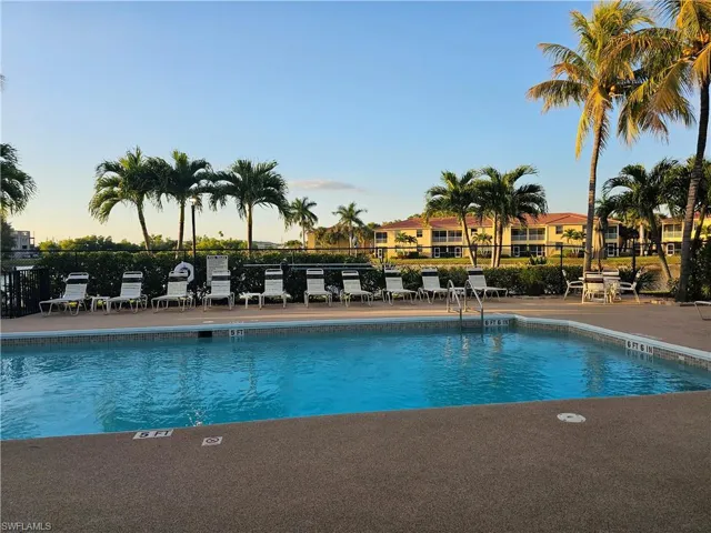 Community pool with a patio