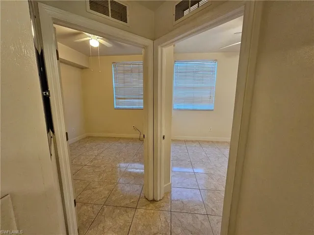 Empty room featuring baseboards