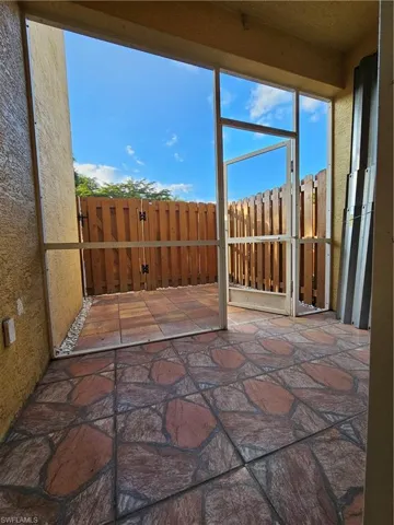 Unfurnished sunroom featuring plenty of natural light