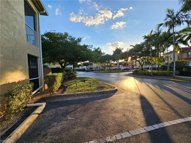 View of asphalt road with curbs