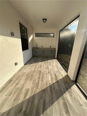 Corridor featuring light wood-type flooring
