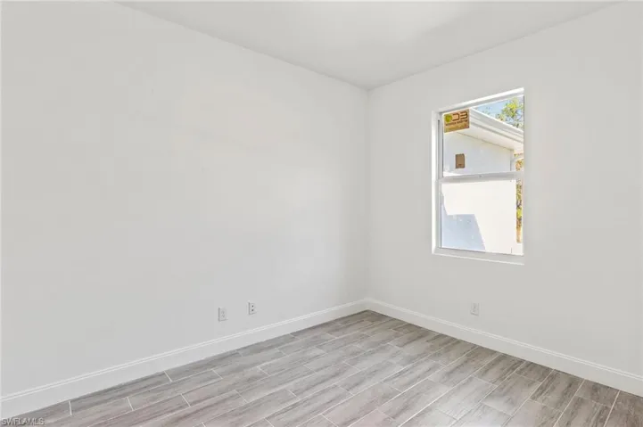 Spare room featuring light wood-type flooring