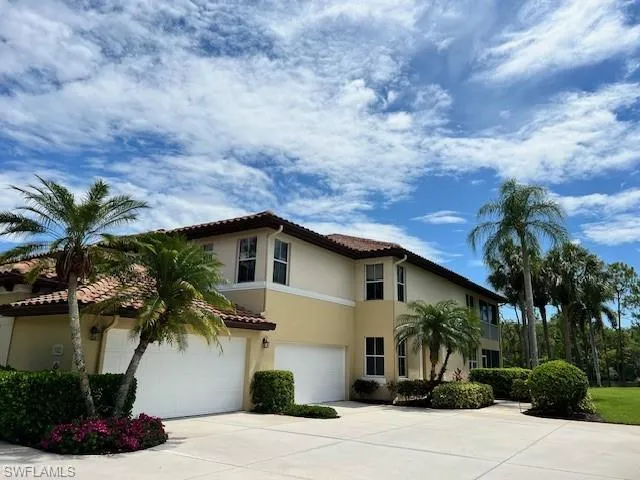 Mediterranean / spanish-style home with a garage