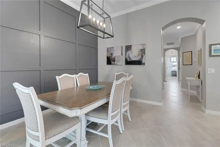 Formal dining area with accent wall