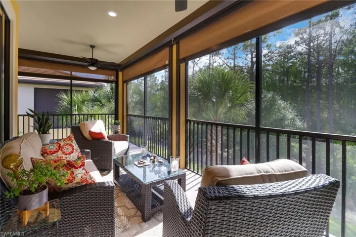 Large lanai overlooking preserve area.  Electric storm shutters lets you enjoy the great outdoors even during our summer afternoon rain storms