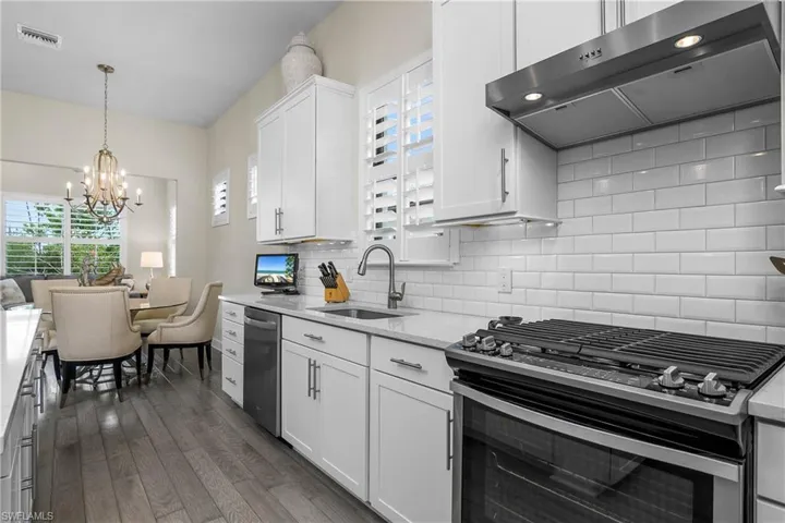 Open Kitchen, dining, sunroom and plenty of windows bringing in lots of natural light.