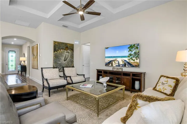 Arched entry and spacious foyer leads to open family room.