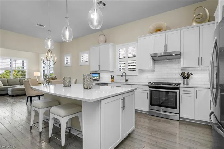 Fabulous open floor plan with sunroom...Kitchen is open and inviting, with plenty of storage, and is the perfect space for entertaining guests.