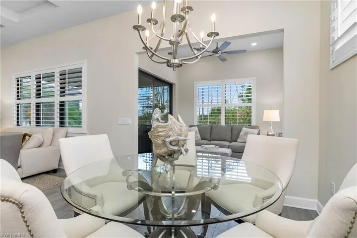 Dining area and adjacent sun room.