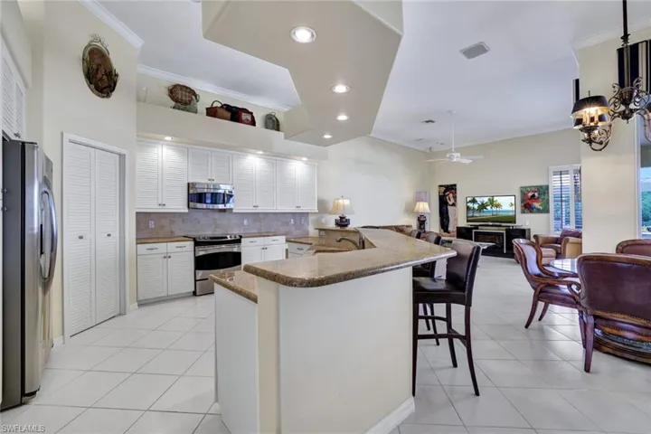 Spacious kitchen with a breakfast nook, stainless steel appliances, and pantry.  The kitchen is open to the family room.