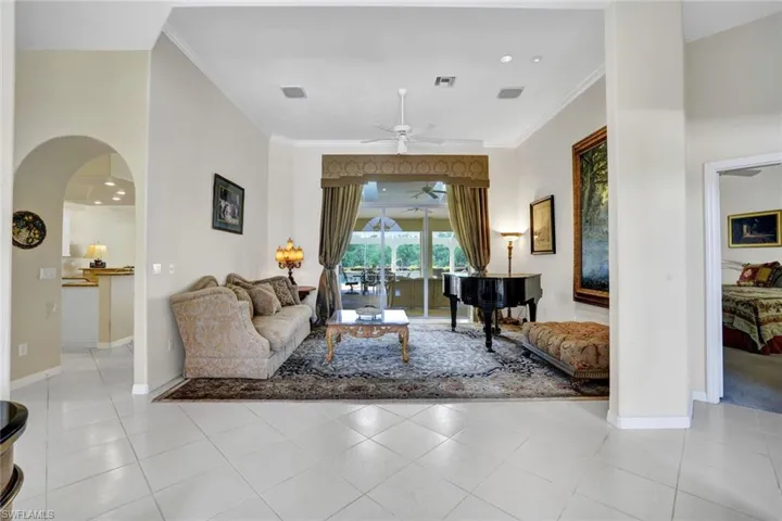 Formal living room with disappearing sliders out to massive covered lanai area.