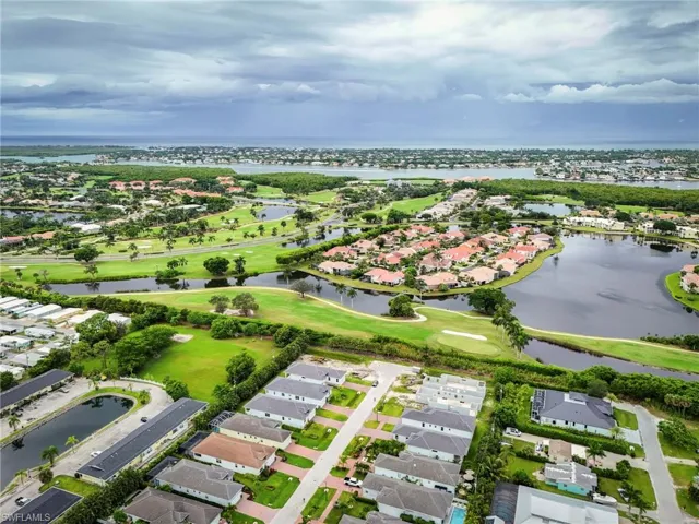 View of property location with nearby suburban area and a nearby body of water