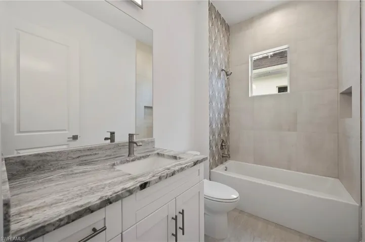 Full bath with bathtub / shower combination and vanity