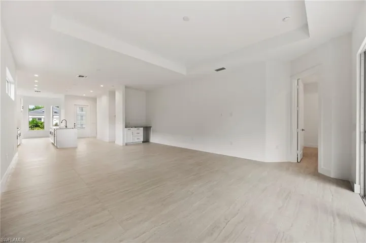 Unfurnished living room with recessed lighting and light wood finished floors