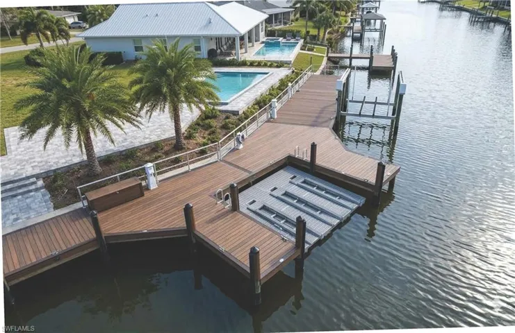 Conceptual rendering of a potential dock & boat lift. Lot is vacant. Dock & Boat Lift not included