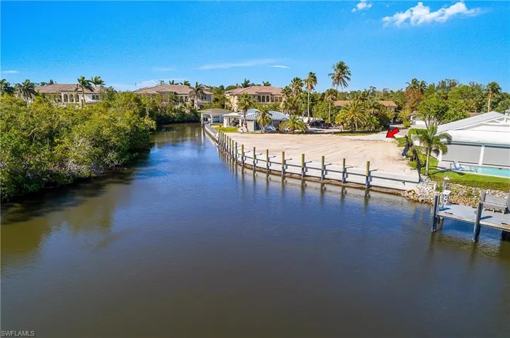 Dock with a water view and a residential view