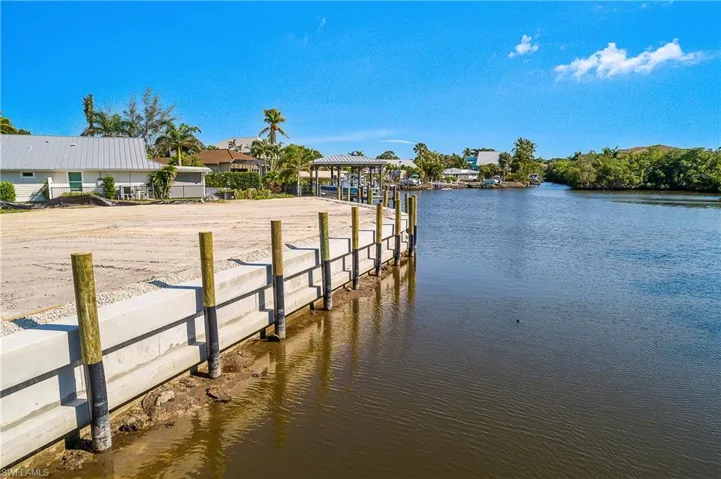 Dock with a water view and a boat ramp