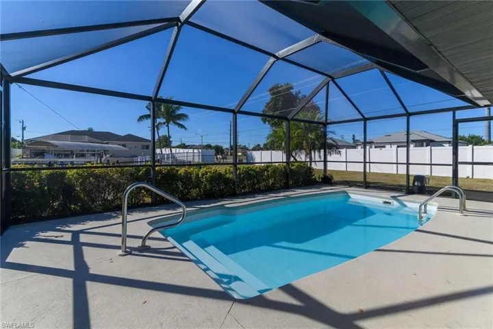 View of pool with a lanai, a sunroom, and a patio area