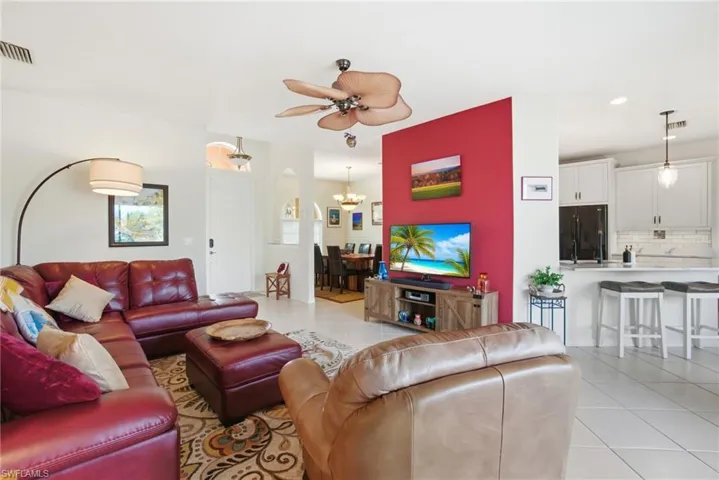Recently modernized kitchen (2024) offers quartz countertops, crisp white cabinetry, a reverse osmosis water filtration system under the sink, and a breakfast bar ideal for casual dining.