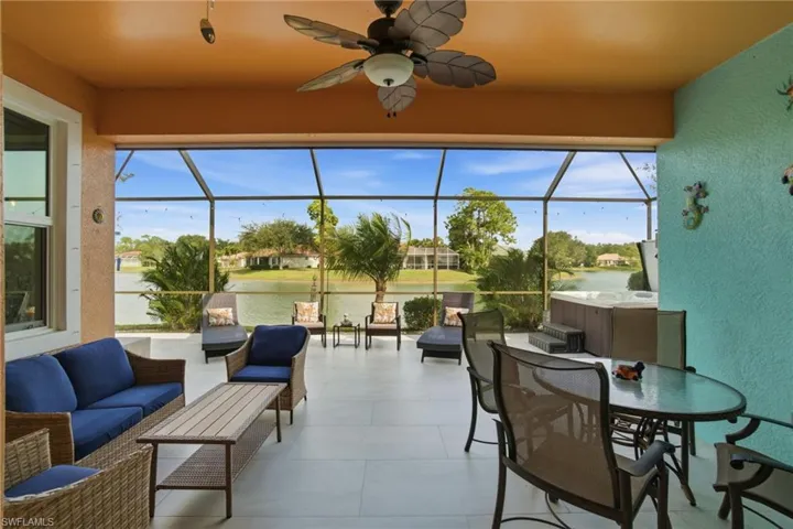 Step outside to the expansive lanai, complete with a spa overlooking the picturesque lake, creating the perfect setting for relaxation or entertaining.