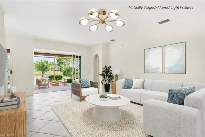 Light and bright interior features 3 bedrooms plus a den, 2 bathrooms, fresh interior paint (2024), and tile flooring throughout the main living areas.