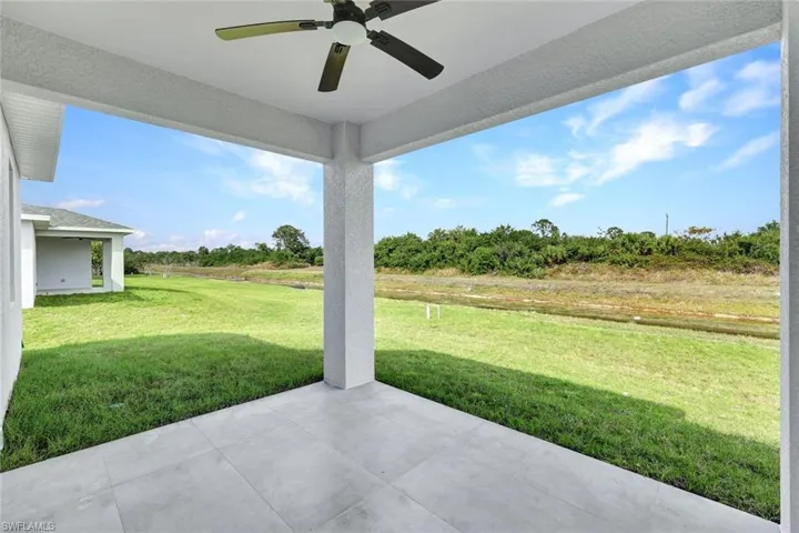 View of patio / terrace with a ceiling fan and a view of rural / pastoral area
