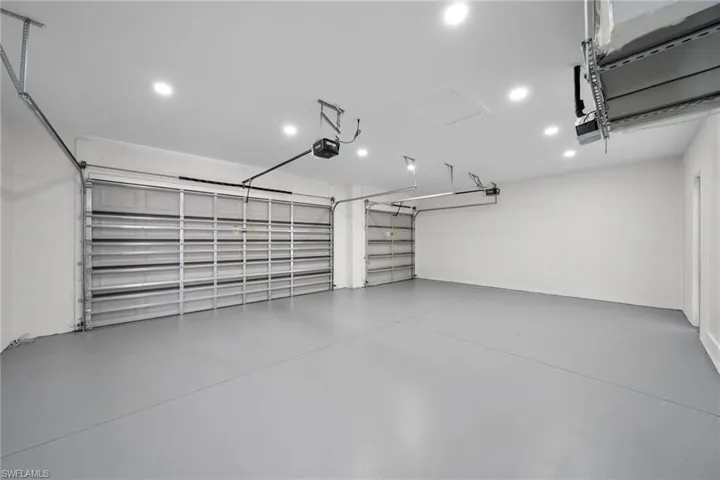 Garage featuring a garage door opener