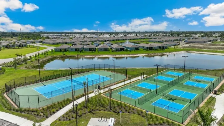 Community amenities include a tennis court, six pickleball courts, and a scenic pond with a fountain