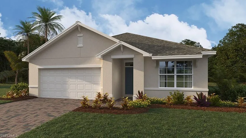 View of front of home featuring a front lawn and a garage