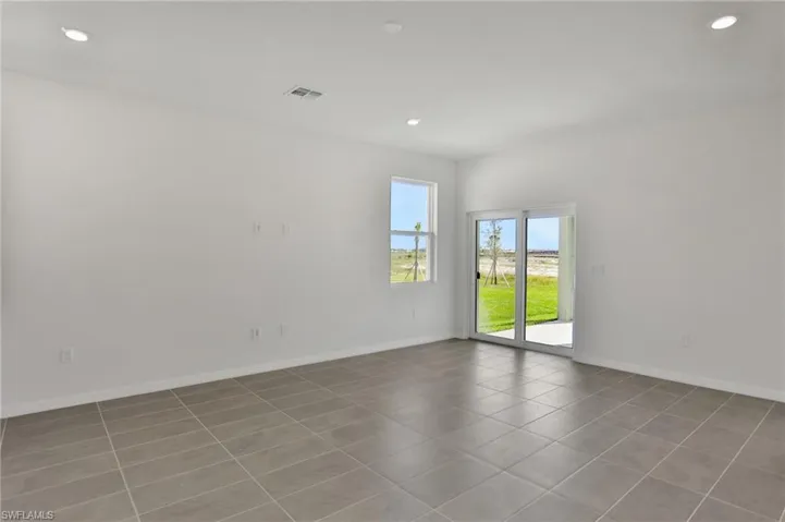 Spare room with recessed lighting and light tile patterned floors