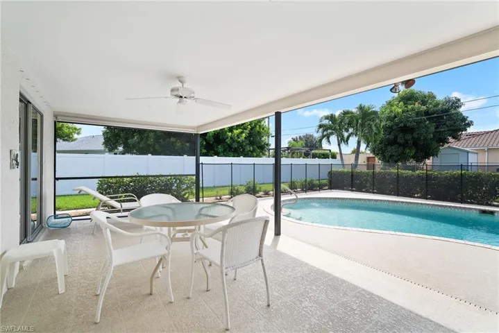 View of pool featuring a patio and ceiling fan