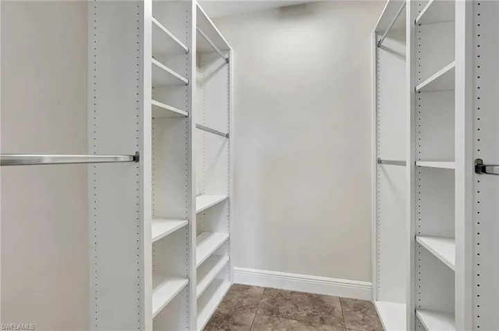 Walk in closet featuring light tile patterned floors