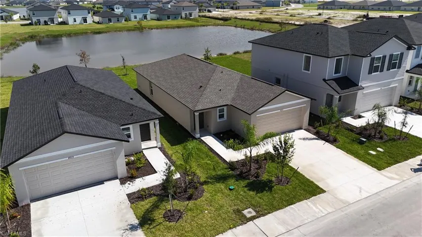 Aerial view of residential area with a large body of water