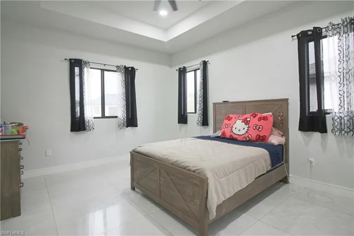 Tray ceiling with recessed lighting and a ceiling fan