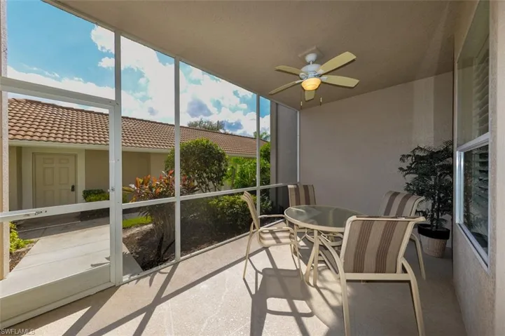 Sunroom / solarium featuring a ceiling fan and outdoor dining space
