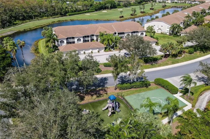 Drone / aerial view of a local golf course and a large body of water