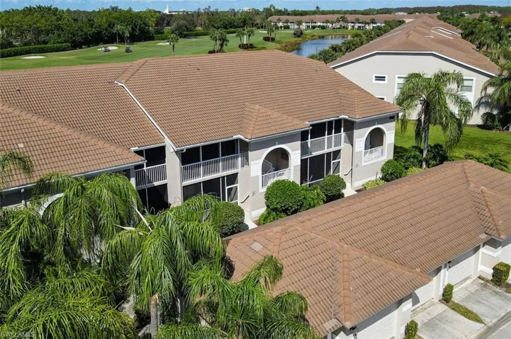 Drone / aerial view of a large body of water and a golf course